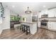 Modern kitchen features stainless steel appliances, granite countertops, and a cozy breakfast bar with seating at 1632 Charles Raper Jonas Hwy, Mount Holly, NC 28120