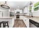 Well-equipped kitchen featuring stainless steel appliances, granite countertops, and modern fixtures at 1632 Charles Raper Jonas Hwy, Mount Holly, NC 28120