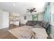 Open-concept living area with a sectional sofa, modern rug, and views of the kitchen at 1632 Charles Raper Jonas Hwy, Mount Holly, NC 28120