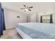 Relaxing primary bedroom with a ceiling fan and natural light, creating a calm and inviting retreat at 1632 Charles Raper Jonas Hwy, Mount Holly, NC 28120