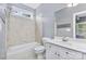 Bright bathroom with a combined shower and tub, toilet, vanity, and a large mirror at 187 Spring Run Dr, Mooresville, NC 28117