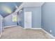 Spacious bedroom with a sloped ceiling, carpet floors, a white door, and ample natural light at 187 Spring Run Dr, Mooresville, NC 28117
