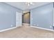 Comfortable bedroom featuring carpet floors, a ceiling fan, and a doorway to another room at 187 Spring Run Dr, Mooresville, NC 28117