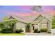 Charming home with neutral siding, well-maintained landscaping, and attached two car garage at 187 Spring Run Dr, Mooresville, NC 28117