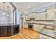 Kitchen featuring custom cabinets, stainless steel appliances, hardwood floors and tile backsplash at 187 Spring Run Dr, Mooresville, NC 28117