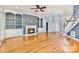 Spacious living room featuring hardwood floors, built-in shelving, and fireplace with mantle at 187 Spring Run Dr, Mooresville, NC 28117