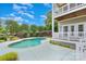 Relaxing backyard pool with a concrete patio, well-kept landscaping, and a backdrop of lush trees at 187 Spring Run Dr, Mooresville, NC 28117