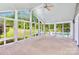 Bright sunroom with ample windows providing natural light and views of the lush backyard at 187 Spring Run Dr, Mooresville, NC 28117