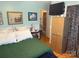 Bedroom with a view of the ensuite bathroom, with patterned curtains at 1895 Sandy Cir, Newton, NC 28658