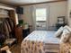Comfortable bedroom with a large window providing ample natural light, and a full closet at 1895 Sandy Cir, Newton, NC 28658