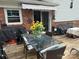 Enjoy outdoor dining on this deck, which features a glass table and seating for four at 1895 Sandy Cir, Newton, NC 28658
