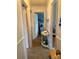 Hallway with carpet flooring, trim work, and view into another room at 1895 Sandy Cir, Newton, NC 28658