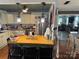 Open kitchen featuring a butcher block island, stainless steel fridge, and view into the living room at 1895 Sandy Cir, Newton, NC 28658