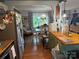 Kitchen with stainless steel fridge, wood countertops, and view into the dining area at 1895 Sandy Cir, Newton, NC 28658