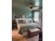 Serene bedroom featuring a comfortable bed, paneled accent wall and stylish decor at 1895 Sandy Cir, Newton, NC 28658