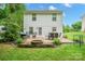 Exterior rear view of a home featuring a patio area with a dining set and a fire pit at 1912 8Th Se St, Hickory, NC 28602