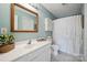 Bathroom with a white vanity, a framed mirror, and white shower curtain at 1912 8Th Se St, Hickory, NC 28602