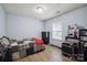 Well-lit bedroom with warm wood floors, neutral walls, and ample space at 1912 8Th Se St, Hickory, NC 28602