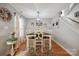 Dining room with seating for six, chandelier, and bright windows at 1912 8Th Se St, Hickory, NC 28602