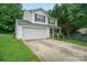 Traditional two-story home featuring an attached garage and a concrete driveway at 1912 8Th Se St, Hickory, NC 28602