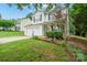 Charming two-story home featuring a well-manicured lawn and attached two car garage at 1912 8Th Se St, Hickory, NC 28602