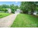 Traditional two-story home with a well-manicured front lawn and a concrete driveway at 1912 8Th Se St, Hickory, NC 28602
