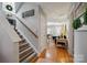 Inviting foyer with hardwood floors, a staircase, and a view into the bright living room at 1912 8Th Se St, Hickory, NC 28602
