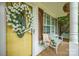 Inviting front porch featuring a white tulip wreath and charming decorations at 1912 8Th Se St, Hickory, NC 28602