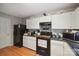 Efficient kitchen with black appliances and lots of counter and storage space at 1912 8Th Se St, Hickory, NC 28602