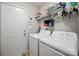 Efficient laundry room with washer, dryer, and ample storage space for convenience at 1912 8Th Se St, Hickory, NC 28602