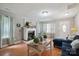 Cozy living room with fireplace, hardwood floors, and comfortable blue sofa at 1912 8Th Se St, Hickory, NC 28602