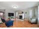 Cozy living room with hardwood floors, fireplace, and neutral paint colors at 1912 8Th Se St, Hickory, NC 28602
