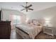 Spacious main bedroom with wood floors, neutral walls, and a ceiling fan at 1912 8Th Se St, Hickory, NC 28602
