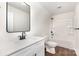 Bright bathroom featuring a tub with shower, white vanity, a framed mirror, and modern fixtures at 2043 Sadler Woods Ln, Charlotte, NC 28214