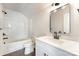 Modern bathroom with tub-shower combo, sleek vanity, framed mirror, and contemporary fixtures at 2043 Sadler Woods Ln, Charlotte, NC 28214