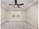 Bright bedroom with ceiling fan, recessed lighting, and double windows at 2043 Sadler Woods Ln, Charlotte, NC 28214