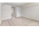 Bedroom features neutral carpet, white walls, and an interior door at 2043 Sadler Woods Ln, Charlotte, NC 28214