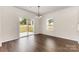 Bright dining area with sliding glass door and view of the outdoor space and backyard at 2043 Sadler Woods Ln, Charlotte, NC 28214