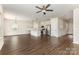 Open living space with kitchen and hardwood floors, creating a warm and inviting atmosphere at 2043 Sadler Woods Ln, Charlotte, NC 28214