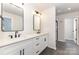 Bathroom featuring double vanity with black fixtures, walk-in shower, and tile flooring at 2051 Sadler Woods Ln, Charlotte, NC 28214