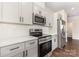 Modern kitchen featuring stainless steel appliances, white subway tile backsplash, and white cabinets at 2051 Sadler Woods Ln, Charlotte, NC 28214