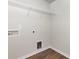 Bare laundry room with wire shelving, wood flooring, and hookups at 2051 Sadler Woods Ln, Charlotte, NC 28214