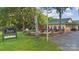 The Rustic Beer and Wine Bar exterior view with patio and lush landscaping at 21013 Running Creek Dr # 4, Locust, NC 28097