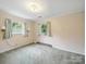 Bedroom with two windows and sconce lights at 220 Lakeview Dr, Belmont, NC 28012