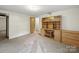 This bedroom features neutral walls, plush carpeting, and a built in cabinet to match the door at 220 Lakeview Dr, Belmont, NC 28012