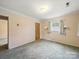 Bedroom featuring carpet, natural light, and sconce lights at 220 Lakeview Dr, Belmont, NC 28012