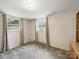 This room features neutral walls, plush carpeting, two windows that lets in natural light and a built in cabinet at 220 Lakeview Dr, Belmont, NC 28012