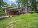 A view of the back of the house featuring a covered patio and screened in porch at 220 Lakeview Dr, Belmont, NC 28012