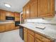 Well-appointed kitchen featuring wood cabinets, granite counters and modern appliances at 220 Lakeview Dr, Belmont, NC 28012
