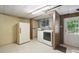Functional laundry room with a washer, dryer, utility sink and extra storage refrigerator, great for chores and organization at 220 Lakeview Dr, Belmont, NC 28012